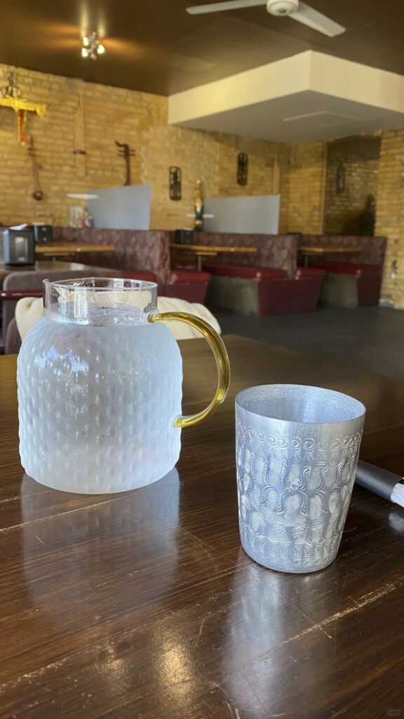 Thai restaurant interior seating and table setup in Winnipeg